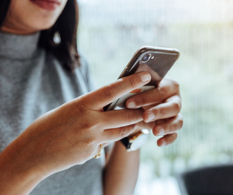 A woman using a mobile.